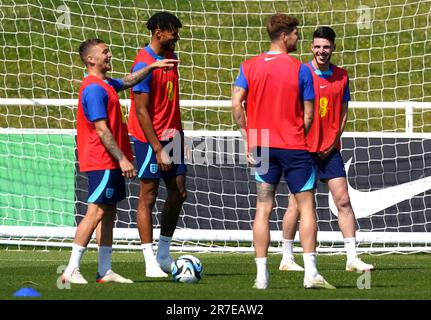 England's Declan Rice (right) with Kieran Trippier (left), Tyrone Mings and John Stones during a training session at St. George's Park, Burton-upon-Trent. Picture date: Thursday June 15, 2023. Stock Photo
