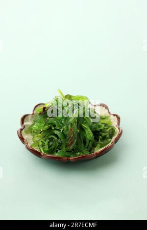 Chuka Wakame Seaweed Salad on Ceramic Plate, Japanese Food Sushi Side Dish. Copy Space for Text Stock Photo