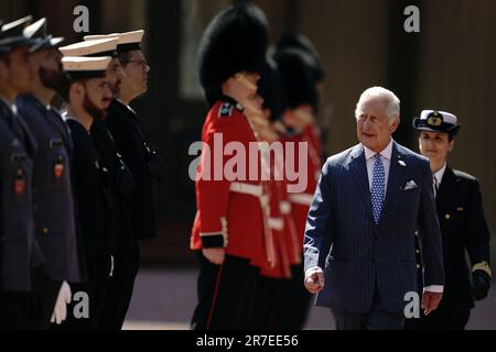 King Charles III during an inspection of the Buckingham Palace detachment of the King's Guard on the forecourt of the palace in London, during President of Portugal, Marcelo Rebelo de Sousa's visit to the UK to mark the 650th Anniversary of the Anglo-Portuguese Alliance. Picture date: Thursday June 15, 2023. Stock Photo