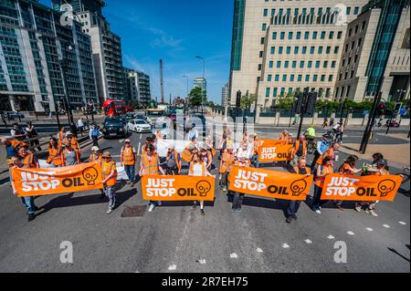 London, UK. 15th June, 2023. Just stop oil protest at Vauxhall Cross on the day that new powers have been given to the police to stop slow walking protests. The group's overall aim is to get the Government to stop all new oil fields. as part of the effort to try to avoid the climate crisis. Credit: Guy Bell/Alamy Live News Stock Photo