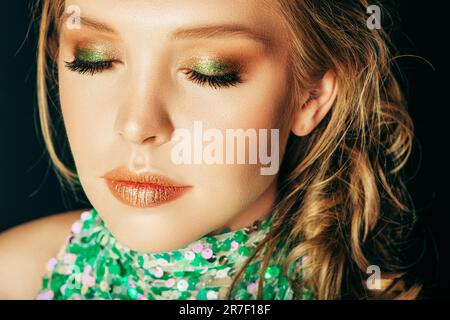 Gold makeup, face glitter or woman with luxury eyeshadow, cosmetics product  and skincare glow. Beau Stock Photo by YuriArcursPeopleimages