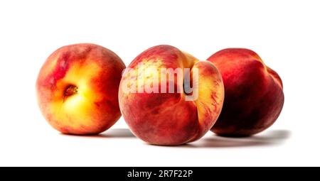 Ripe juicy peaches isolated on white background. Three whole peaches. Stock Photo
