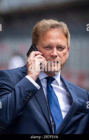 London, UK.  15 June 2023.  Grant Shapps, Secretary of State for Energy Security and Net Zero, on his phone at lunchtime outside The Ivy Restaurant Victoria in Westminster ahead of being collected by his driver.  Credit: Stephen Chung / Alamy Live News Stock Photo