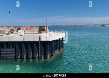 The North Quay and entrance to Newquay Harbour in Cornwall in England in the UK. Stock Photo