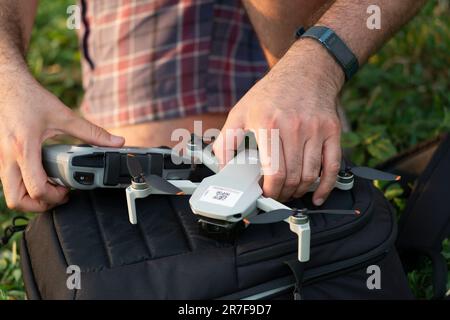 Man Checking a Drone Stock Photo