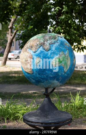 photo of a globe-shaped object in the street Stock Photo