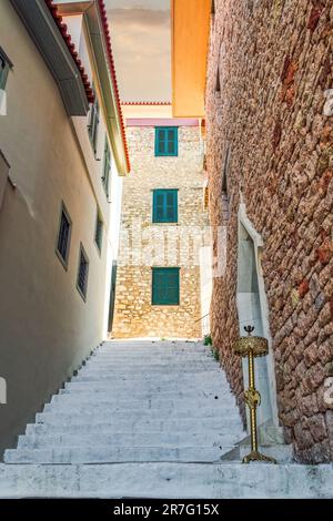 White-painted stone steps around traditional houses with a candle holder outside in Nafplion, Greece. Stock Photo