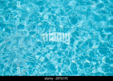 blue pool surface, swimming pool water background, idea for background or screen, vacation and vacation. Stock Photo