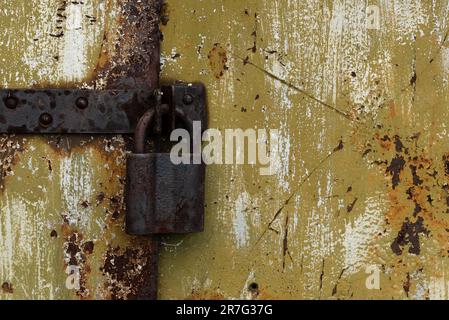 Old rusty lock on metal doors. Lock on the door with an empty place for an inscription Stock Photo