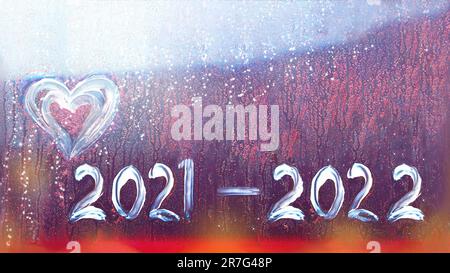 Abstract background new year number 2022 and old 2021. Happy New Year 2022. Heart and inscription 2021, 2022 on glass Stock Photo