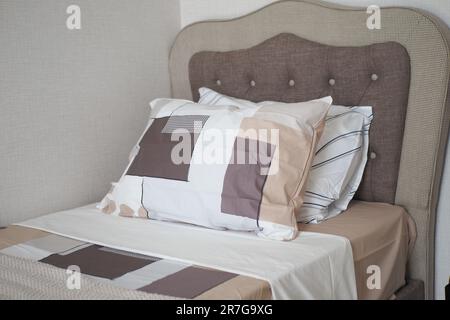 white pillow lined up on bed  Stock Photo