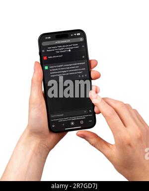 Lodz, Poland May 14 2023 hand using AI on mobile phone, Chat GPT app communication. Stock Photo