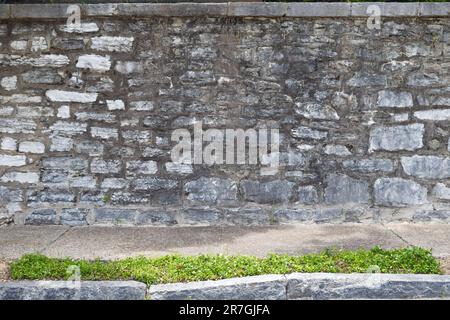 Large stone wall ledge sidewalk background Stock Photo