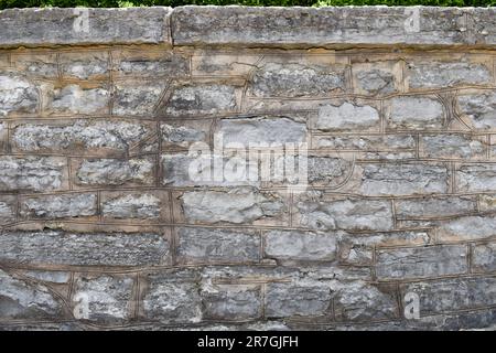 Large stone wall ledge background Stock Photo