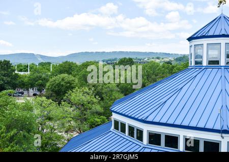 Beautiful mountain skyline with blue roof building Stock Photo