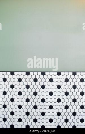 Painted wall and black and white hexagon tile design Stock Photo