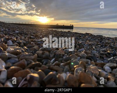 Looking Across a Decorative Stack of Different Coloured Stones, Pebbles and Cobbles at Hampton Stone Beach, Hampton Pier, in Herne Bay, Kent, UK. Stock Photo