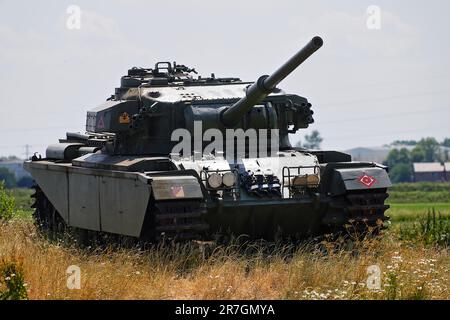 a-preserved-centurion-battle-tank-sits-as-a-roadside-landmark-near-to