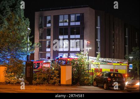 Church Road, Edgbaston, Birmingham 15th June 2023 - West Midlands Fire Service tackled a severe fire in a student halls of residence on Thursday evening. Forty-five firefighters raced to Vale Village, a residential area owned by the University of Birmingham. A 4th floor kitchen in ‘Chamberlain C' which fronts Church Road in the Edgbaston area of the city was blackened out by the blaze and smoke with firefighters seen inside the property using flashlights to investigate the cause of the incident. The heat of the fire broke the internal panes of the double glazed windows however the fire only br Stock Photo