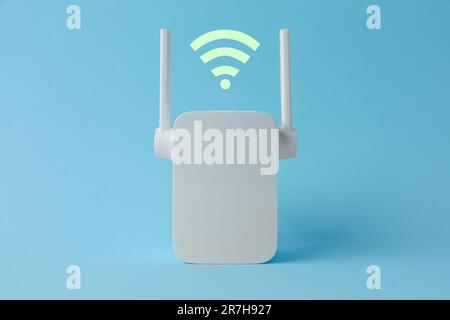 Modern repeater and Wi-Fi symbol on light blue background Stock Photo