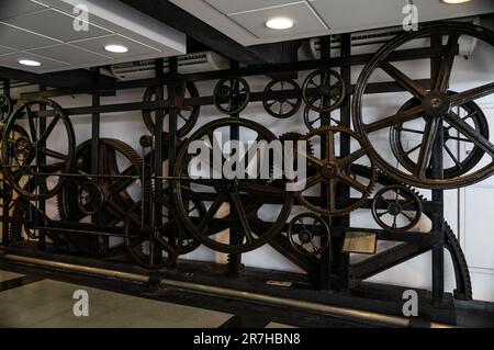 A set of retired gears and pulleys of older Sugarloaf cable car machinery at the entrance of the station at General Tiburcio square in Urca district. Stock Photo