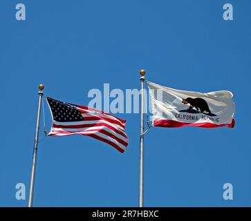 American stars and stripes flag and California Republic grizzly Bear state flag in Dublin, California Stock Photo