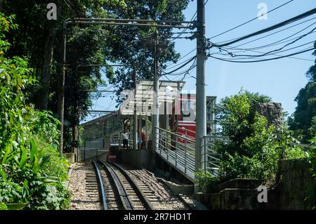 Corcovado Rack Railway train tracks nearby Paineiras station, inside Tijuca forest in Santa Teresa district under summer afternoon sunny blue sky. Stock Photo