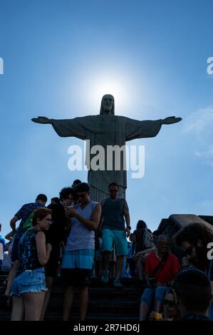 Sun hiding behind Christ the Redeemer statue located on Corcovado