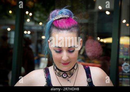 Asheville, North Carolina, USA. 10th June, 2023. Sawyer, who uses only their first name, identifies as a ''non-binary, neurodivergent millennial' with a disability, and uses they/their pronouns. Sawyer works as a manager at the Madam Clutterbucket Neurodiverse Universe gift shop in Asheville that primarily employs those with developmental disabilities. (Credit Image: © Robin Rayne/ZUMA Press Wire) EDITORIAL USAGE ONLY! Not for Commercial USAGE! Stock Photo