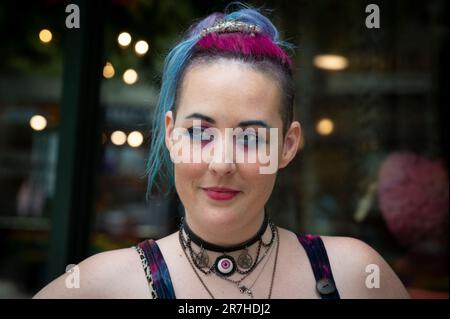 Asheville, North Carolina, USA. 10th June, 2023. Sawyer, who uses only their first name, identifies as a ''non-binary, neurodivergent millennial' with a disability, and uses they/their pronouns. Sawyer works as a manager at the Madam Clutterbucket Neurodiverse Universe gift shop in Asheville that primarily employs those with developmental disabilities. (Credit Image: © Robin Rayne/ZUMA Press Wire) EDITORIAL USAGE ONLY! Not for Commercial USAGE! Stock Photo