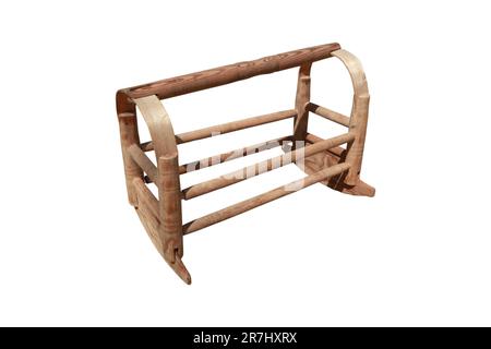 Wooden doll cradle. Antique crib. Stock Photo