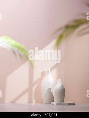 Vases and objects on the table in a warm room with sunlight coming in Stock Photo