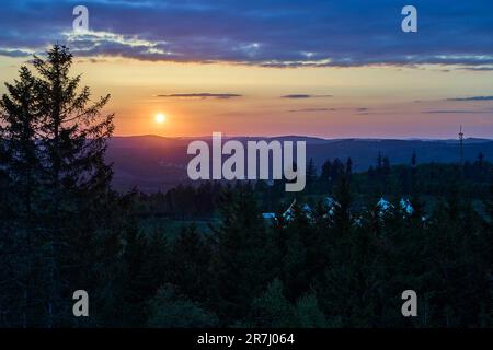 sunset over the mountain range of the Rothaargsteig close to Luetzel in Germany. Stock Photo
