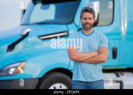 Men driver near lorry truck. Man owner truck . Serious middle aged man trucker trucking owner. Transportation industry vehicles. Handsome man driver Stock Photo
