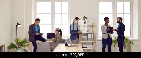 Multiracial corporate employees and business people working in a modern company office Stock Photo