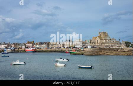harbour of the pituresque fishing village of Barfleur on the Cotentin Peninsula with view of ancient Nicolas de Barfleur church, department of Manche, Stock Photo