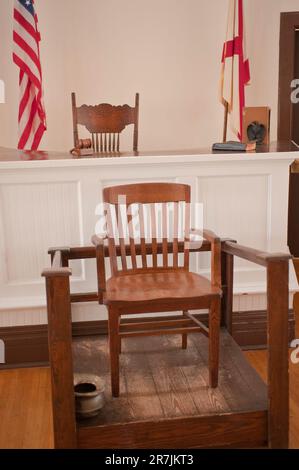 Interior of Monroeville, Alabama courthouse, now a museum showing judges bench and the witness chair. Stock Photo