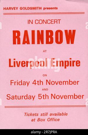 Rock group Rainbow concert flyer Liverpool November 4 and 5th 1977, Liverpool Empire Theatre. Featuring Ritchie Blackmore, Cozy Powell, Ronnie Dio.  A5 size.  This tour was to promote the Long Live Rock and Roll album.   Blackmore climbed into one of the expensive boxes and destroyed his guitar by smashing it over the edge of the box, damaging victorian plasterwork and being banned from the venue as a result. Stock Photo