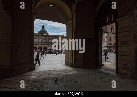 Wide-angle view of architectural glimpses and people of the medieval city of Bologna, in the Emilia-Romagna region, located in northern Italy, Europe. Stock Photo