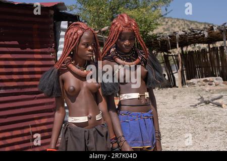 Himba tribeswomen at Epupa falls Cunene River in Namibia on the border with Angola Stock Photo