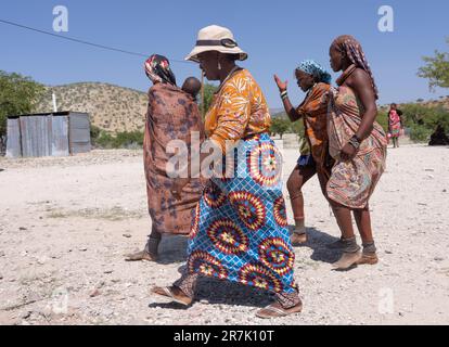 Himba tribeswomen at Epupa falls Cunene River in Namibia on the border with Angola Stock Photo