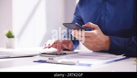 Invoice Accounting And Audit Finance Software On Phone Stock Photo