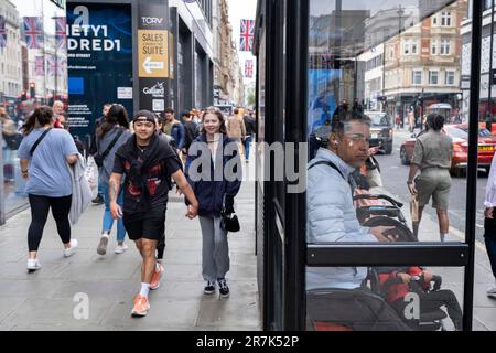 Shoppers and visitors out on Oxford Street on 22nd May 2023 in London, United Kingdom. Oxford Street is a major retail centre in the West End of the capital and is Europes busiest shopping street with around half a million daily visitors to its approximately 300 shops, the majority of which are fashion and high street clothing stores. Stock Photo