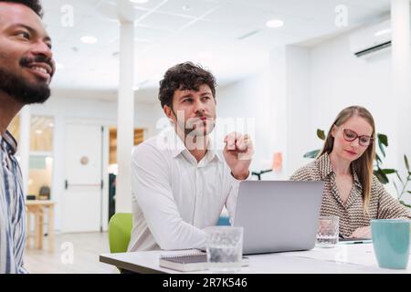 Business colleagues attending a presentation in office Stock Photo