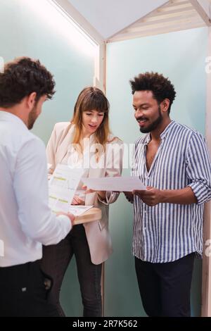 Business colleagues discussing document in office Stock Photo