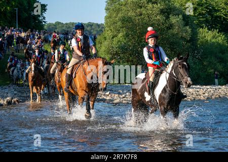 Riders ford the River Ettrick during the Selkirk Common Riding, a ...