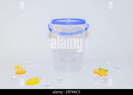 The Versatile Blue Plastic Cylinder Container with Lid is a practical and functional storage solution for your everyday needs Stock Photo
