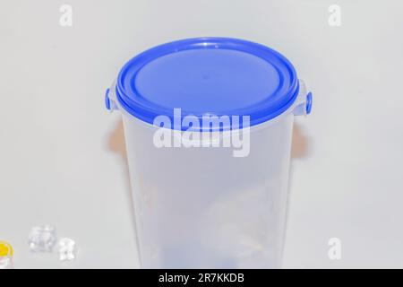 The Versatile Blue Plastic Cylinder Container with Lid is a practical and functional storage solution for your everyday needs Stock Photo