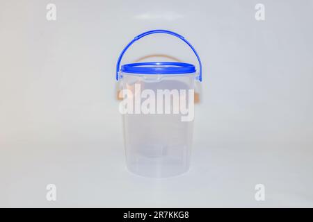 The Versatile Blue Plastic Cylinder Container with Lid is a practical and functional storage solution for your everyday needs Stock Photo