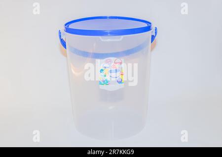 The Versatile Blue Plastic Cylinder Container with Lid is a practical and functional storage solution for your everyday needs Stock Photo